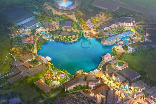 Vista aérea ilustrada del proyecto del primer parque temático de Universal en Europa, con lago central, montañas rusas, hoteles y áreas de entretenimiento.
